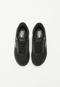 Black athletic shoes with a mesh upper, featuring lace-up design, cushioned insole, and logo accents. Rounded toe and textured sole.