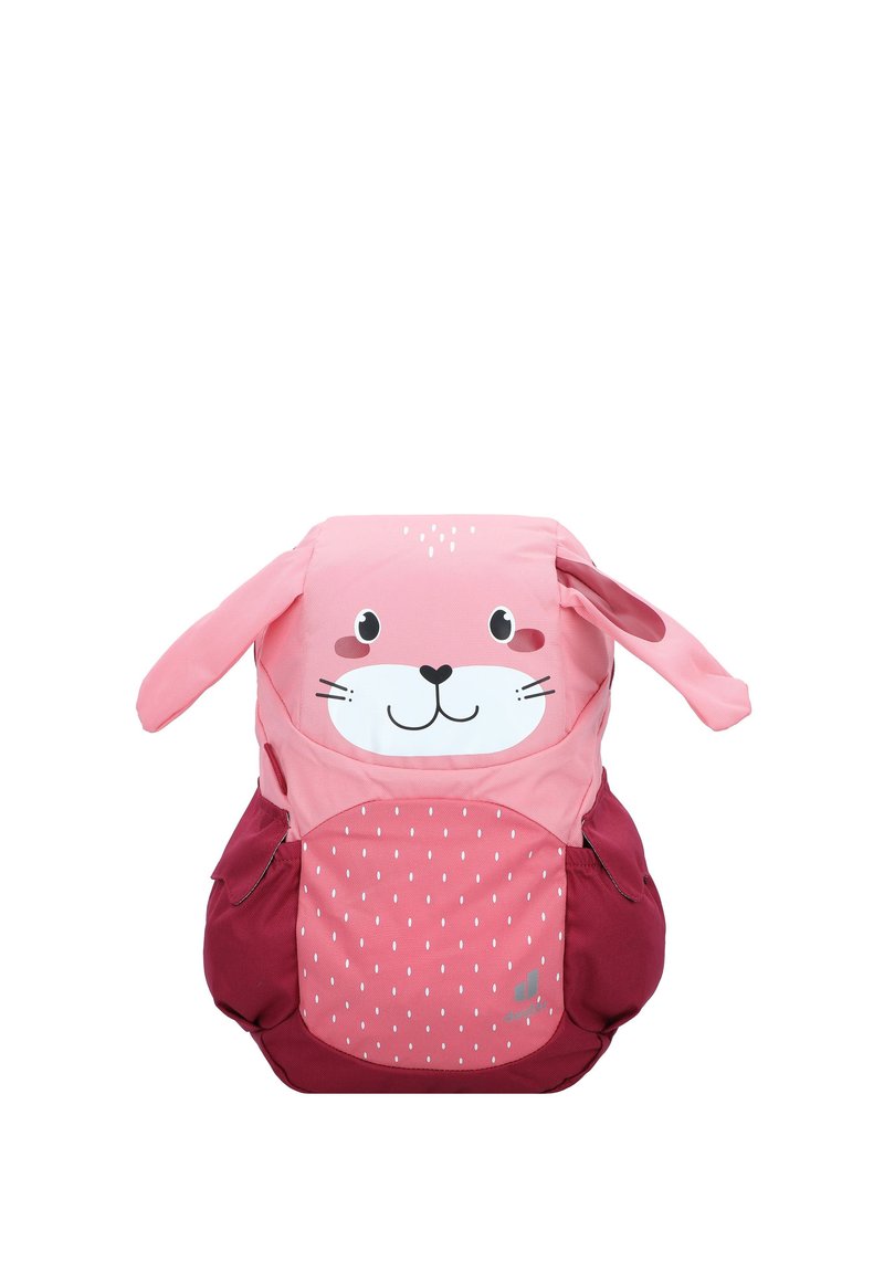 Rosa Rucksack im Kaninchen-Design mit langen Ohren, einem lächelnden Gesicht und kastanienbraunen Akzenten. Verfügt über eine strukturierte Oberfläche mit einem gepunkteten Muster.