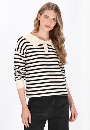 Pullover a righe con un motivo crema e nero, caratterizzato da un colletto largo testurizzato e tre bottoni all'incrocio del collo. Materiale in maglia morbida.
