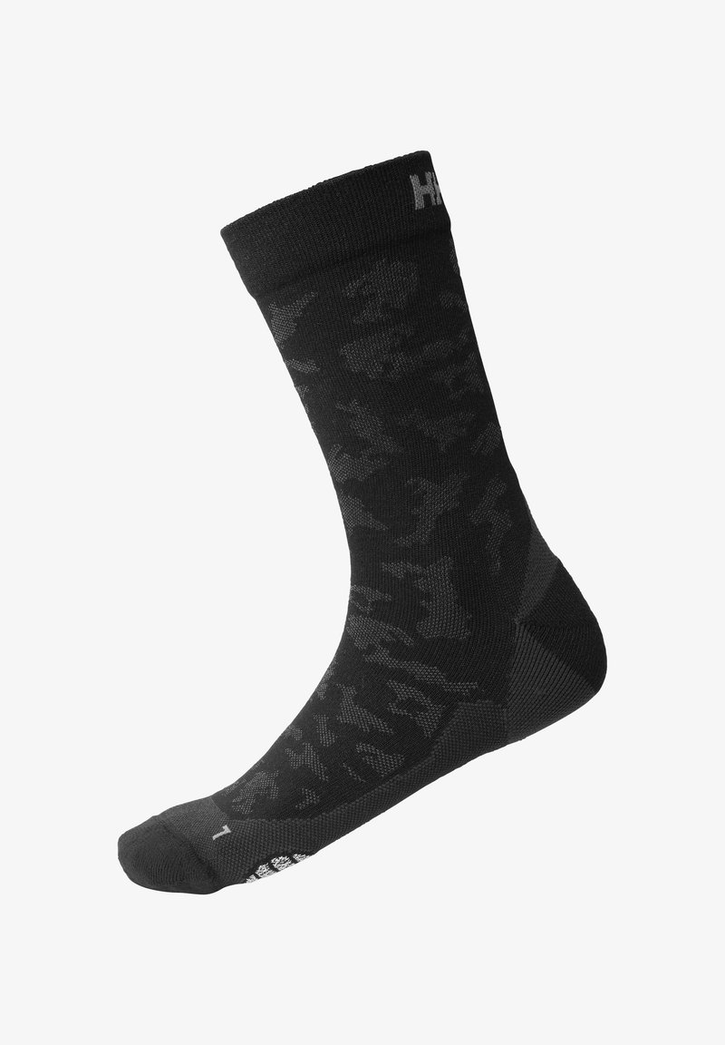 Calcetines negros con un sutil patrón de camuflaje, tejido de punto, talón y puntera reforzados, y un puño acanalado con detalle de logo en contraste.