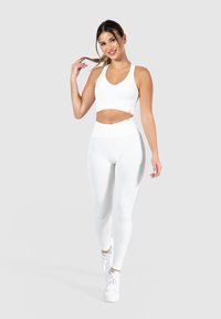 Smilodox AMAZE PRO RACERBACK BH - Sport-bh met medium support - creme