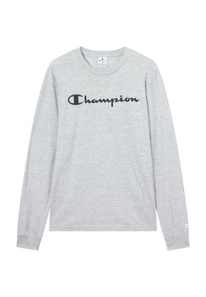 Maglietta grigia a maniche lunghe in cotone con logo nero "Champion" sul petto e piccolo logo sul polsino della manica sinistra.