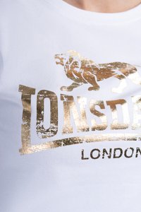 White cotton t-shirt with a round neckline featuring a gold foil lion graphic and stylized text "LONSDALE LONDON" below.