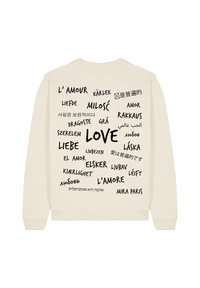 Felpa color crema con scollatura rotonda che presenta la parola "LOVE" in grassetto nero, circondata da traduzioni in vari caratteri e lingue.