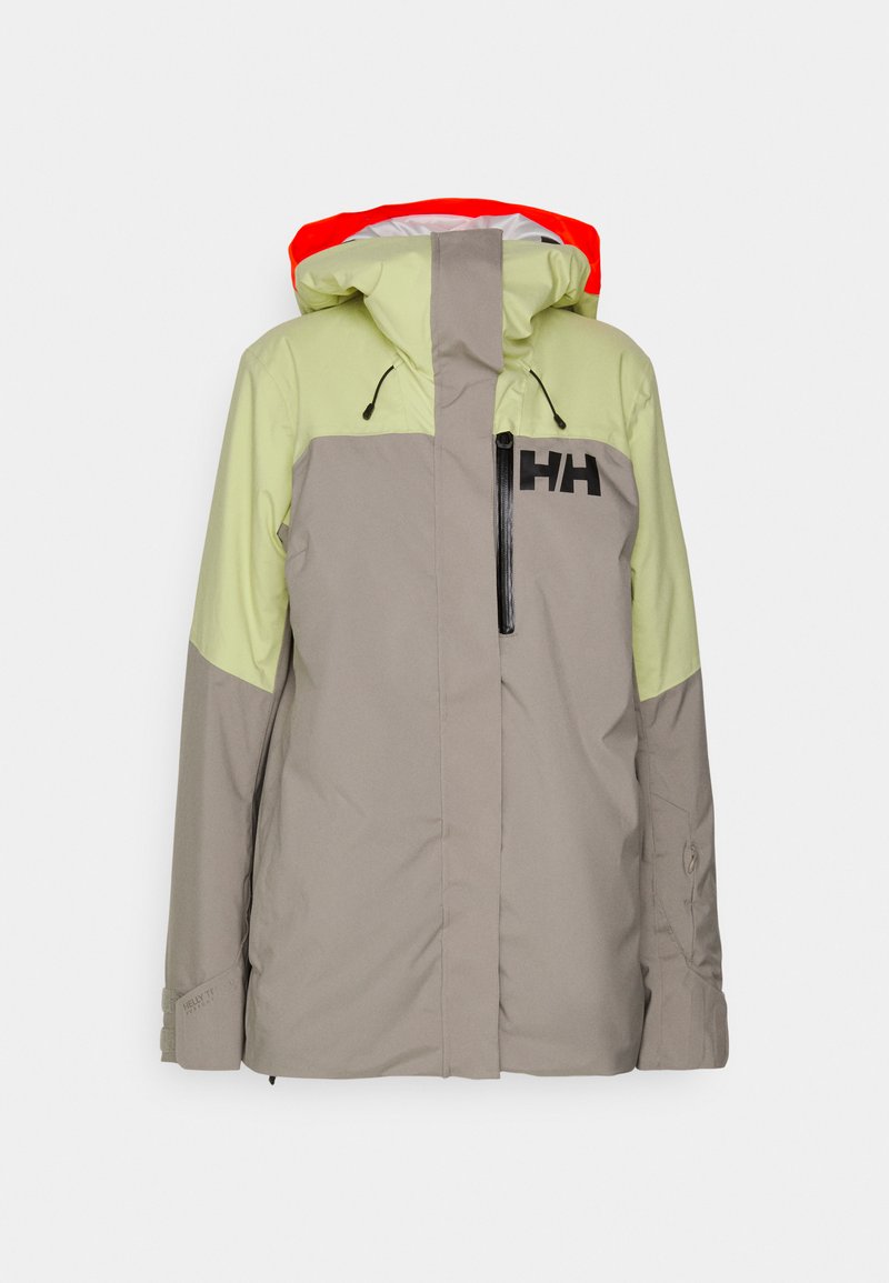 Leichte, isolierte Jacke mit grauem Körper und hellgrünen Schultern. Verfügt über eine rote Kapuze, einen Frontreißverschluss und ein schwarzes Logo auf der Brust.