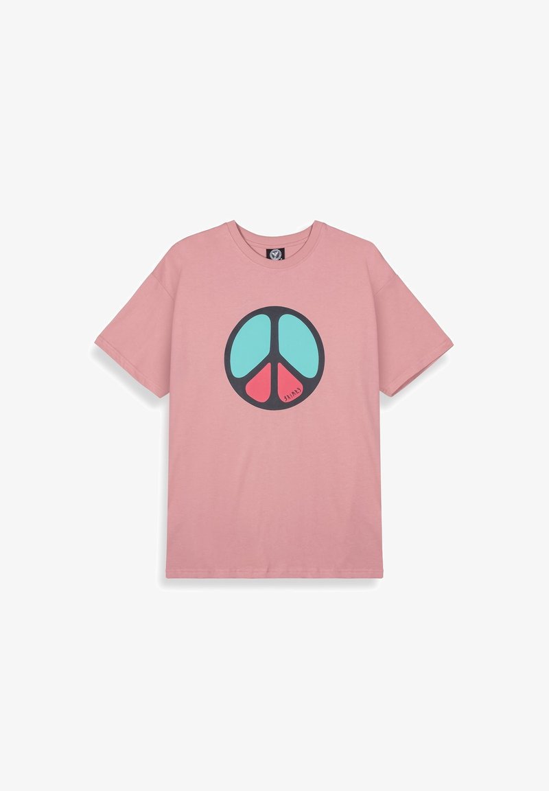 Camiseta de algodón rosa con un gran gráfico de símbolo de paz negro en turquesa y rojo. Mangas cortas, cuello redondo, corte relajado.