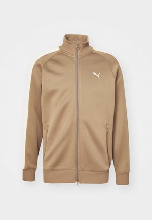 Brun zip-up jacka med hög krage och gräddfärgade sidopaneler. Har ribbade muddar och nederkant, plus en liten vit logotyp på bröstet.