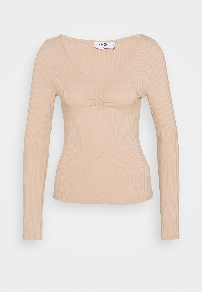 Top a maniche lunghe beige a coste con scollatura a V, caratterizzato da una texture arricciata sulla scollatura. Tessuto morbido ed elastico per una silhouette aderente.