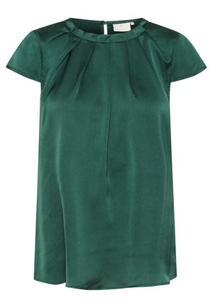 Blouse à manches courtes, de couleur vert foncé, avec un col rond, des détails plissés aux épaules et une texture de tissu lisse. Présente une fermeture éclair au dos.