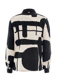 Button-up shirt with a black and off-white abstract pattern. Features a collar, long sleeves, and button cuffs; made of lightweight fabric.