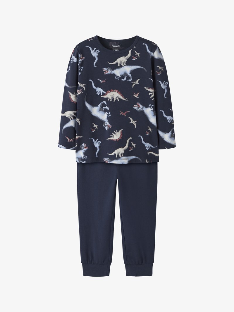 Tmavomodré pyžamo pozostávajúce z dlhého rukávu s dinosaurovým vzorom a zodpovedajúcich nohavíc s elastickými manžetami. Vyrobené z mäkkej, elastickej tkaniny.
