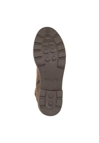 Semelle de botte en daim marron avec un motif de caoutchouc, présentant des formes rondes et ovales pour l'adhérence. Marquée "UNISA" et taille "40."