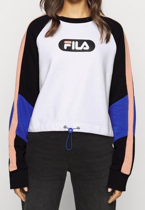 Sweatshirt blanc avec des accents noirs et bleus. Comprend un logo FILA rond, un col côtelé, des manches longues et un ourlet ajustable avec un cordon bleu.