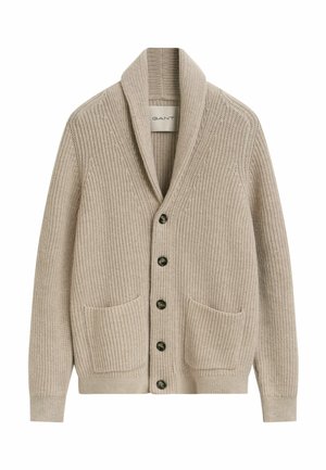 Beige gebreide cardigan met sjaalkraag, vijf donkere knopen aan de voorkant en twee voorzakken.