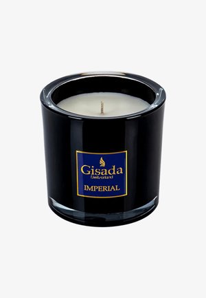 Zwarte glazen kaarsenpot met een witte wascentra en een katoenen lont. Blauwe label toont "Gisada Zwitserland" en "IMPERIAL" in gouden letters.