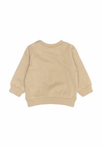 Béžový svetr s dlouhými nafouknutými rukávy, žebrovanými manžetami a kulatým výstřihem. Měkká tkanina s minimem švů a knoflíkem na zádech u výstřihu.