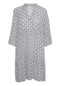 Blommönstrad tunika i vitt, med V-ringning, trekvartsärmar och lös passform. Tillverkad av lätt tyg med en texturerad väv.