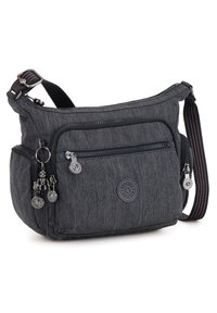Gray fabric shoulder bag with multiple zippered pockets, textured surface, adjustable strap, and decorative keychain accents.
