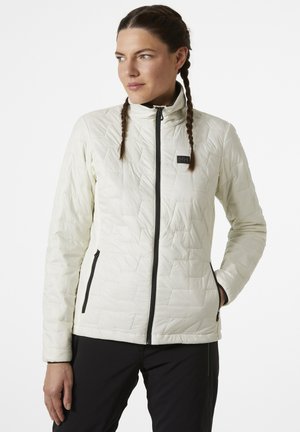 Lichte, gewatteerde jas in off-white met een hoge kraag en ritsluiting. Voorzien van zwarte ritsen en een klein logo op de borst.