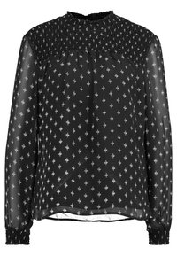 Chemisier noir transparent avec un col smocké, des manches longues et un motif géométrique blanc sur toute sa surface. Texture douce avec des poignets élastiques.