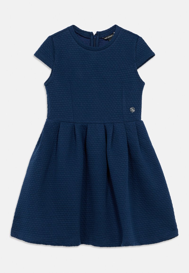 Φόρεμα σε ναυτικό μπλε με υφή, κοντά μανίκια, εφαρμοστό μπούστο και φούστα που φαρδαίνει. Διαθέτει φερμουάρ στην πλάτη και μικρή διακριτική λεπτομέρεια με λογότυπο στο πλάι.