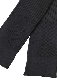 Maniche a maglia nere a costine con tessuto testurizzato e vestibilità aderente. Presentano schemi di maglia a contrasto alle estremità per un tocco di dettaglio e design in più.