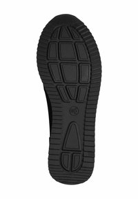 Semelle de chaussure en caoutchouc noir avec un motif de semelle texturé ; présente des formes surélevées et des rainures pour une meilleure adhérence et traction ; logo circulaire au centre.