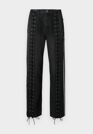 Pantalon en denim noir avec panneaux latéraux ornés de détails à lacets, œillets et cordons ajustables à l'ourlet. Coupe droite.
