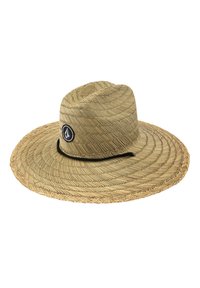 Sombrero de paja de ala ancha con un tejido estampado, un logo circular negro en la parte frontal y una delgada banda negra alrededor de la base.