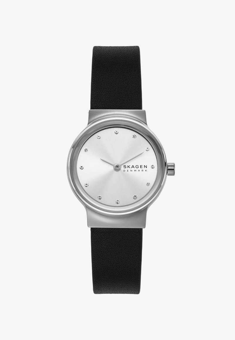 Orologio da polso Skagen minimalista con quadrante rotondo argento, indici delle ore in cristallo, lancette sottili e cinturino in pelle nera.