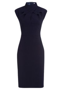 Mörkblå ärmlös klänning med hög krage och plisserad byst. Väl avskuren siluett med knälång fåll och dragkedja bak.