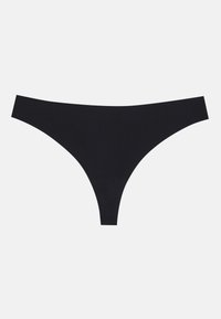Must mustat stringid, mis on valmistatud sujuvast ja venivast kangast. Neil on madal vöökoht, minimaalse katvusega ja nähtamatud õmblused.