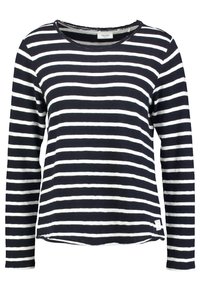 Maglietta a maniche lunghe con righe orizzontali blu navy e bianche, scollatura rotonda e vestibilità rilassata con orlo leggermente curvo.