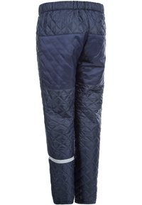 Laivastonsiniset tikatut housut, joissa on joustava vyötärö, sisältäen sileitä ja teksturoituja kangasosia sekä heijastavan raidat alaosassa.