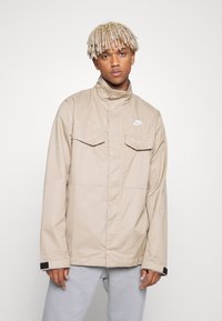 Nike Sportswear Casaco de verão - khaki/white