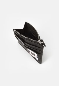 Black leather wallet with textured finish, zip closure, multiple card slots, and a graphic design featuring sunglasses on one side.