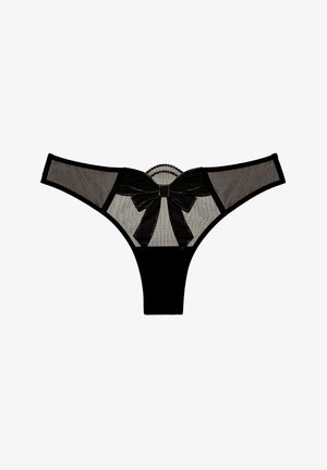 Schwarzer Tanga mit transparenten Netzpaneelen, featuring eine große schwarze Schleife hinten, dekorativen Spitzenbesatz und einer figurbetonten Silhouette.