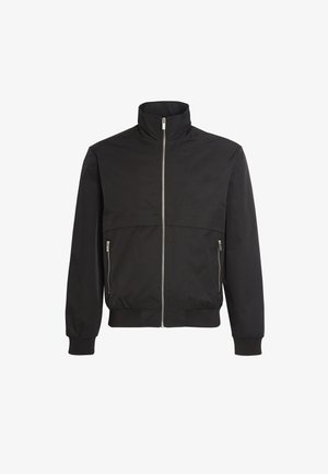 Schwarze Bomberjacke aus glattem Stoff, mit hohem Kragen, Frontreißverschluss, zwei seitlichen Reißverschlüssen und gerippten Bündchen und Saum.