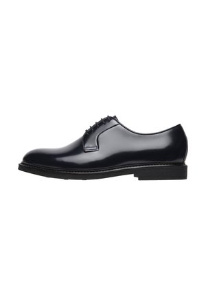 Scarpe eleganti in pelle lucida blu navy con punta tondeggiante, design con lacci e suola in gomma nera. Presenta cuciture minime e linee pulite.