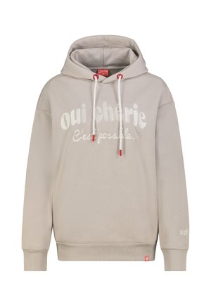 Light beige hoodie with white drawstrings, red accents, and white text "oui chérie C'est possible." printed on front. Ribbed cuffs and hem.