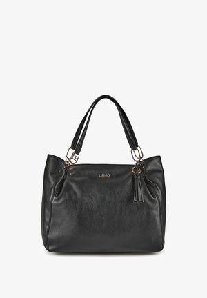 Borsa a mano in pelle nera con doppi manici, hardware dorato, dettaglio con nappina e piccolo logo del marchio al centro sulla parte anteriore.