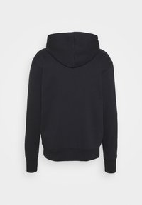 Sweat à capuche noir à manches longues, doté d'une coupe décontractée et de poignets côtelés. Le tissu semble doux et texturé.