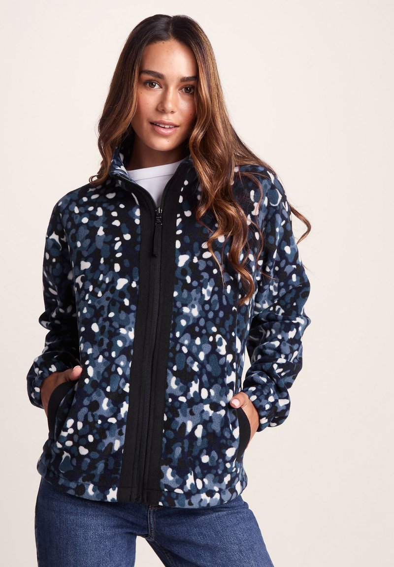 Fleece jacket with a blue and white speckled pattern, featuring a zip front, high collar, and side pockets. Soft texture and relaxed fit.