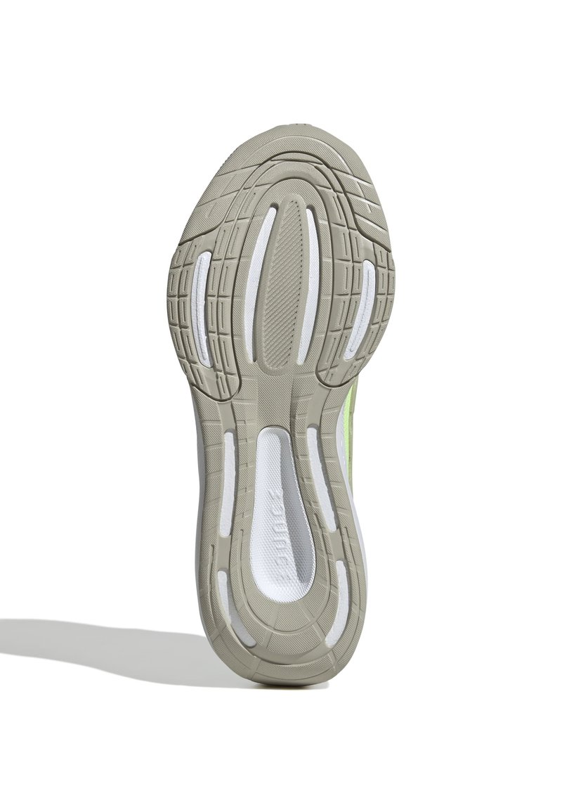 Suela de zapatilla de correr con goma gris claro, patrón de textura y acentos de espuma blanca. Surcos notables para tracción y amortiguación.