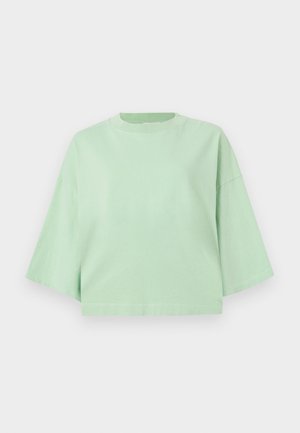 Mint green cropped t-shirt in soft cotton with a round neckline and wide short sleeves. Simple design with no patterns or accents.