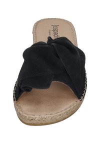 Black slide sandal with a knotted fabric upper, woven jute midsole, and a beige insole. Rounded open toe design.