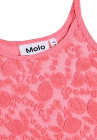 Korallrosa linne med mjukt, strukturerat blommönster. Har Molo-märke och klassisk ärmlös design. Rena kanter utan ytterligare utsmyckningar.