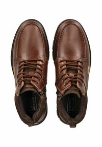 Brown leather ankle boots featuring a lace-up design, padded collar, and a side zipper for easy access; textured surface and rubber sole.