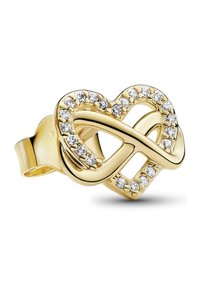 Anello a forma di cuore in oro con un design attorcigliato, accentuato da piccole pietre trasparenti lungo il bordo per un tocco di dettaglio e texture in più.