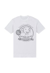Bílý bavlněný tričko s grafikou usmívající se krávy s náušnicemi a textem v šedé barvě "La Vache qui rit" a "Tendrement bon."